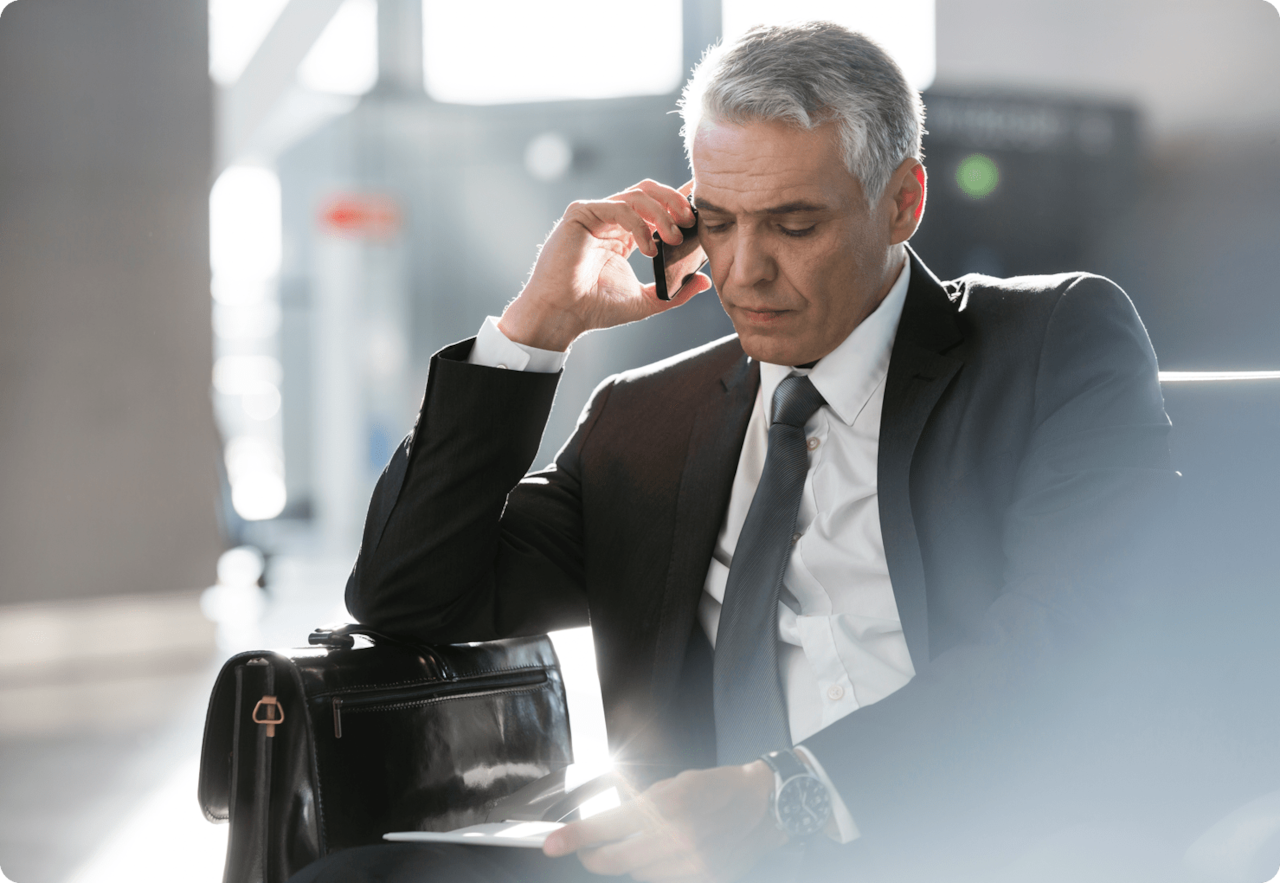 man sitting in airport terminal