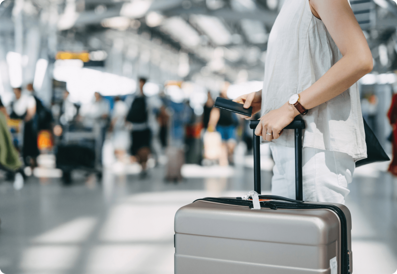 woman with luggage in airport