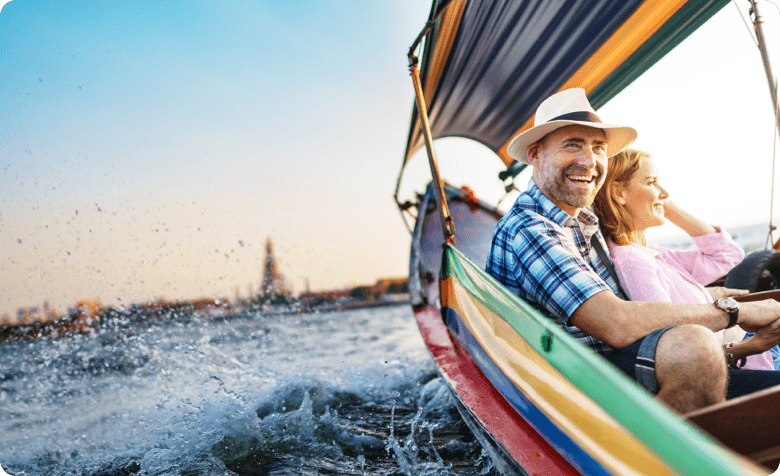 man and woman sitting in multicolored chair