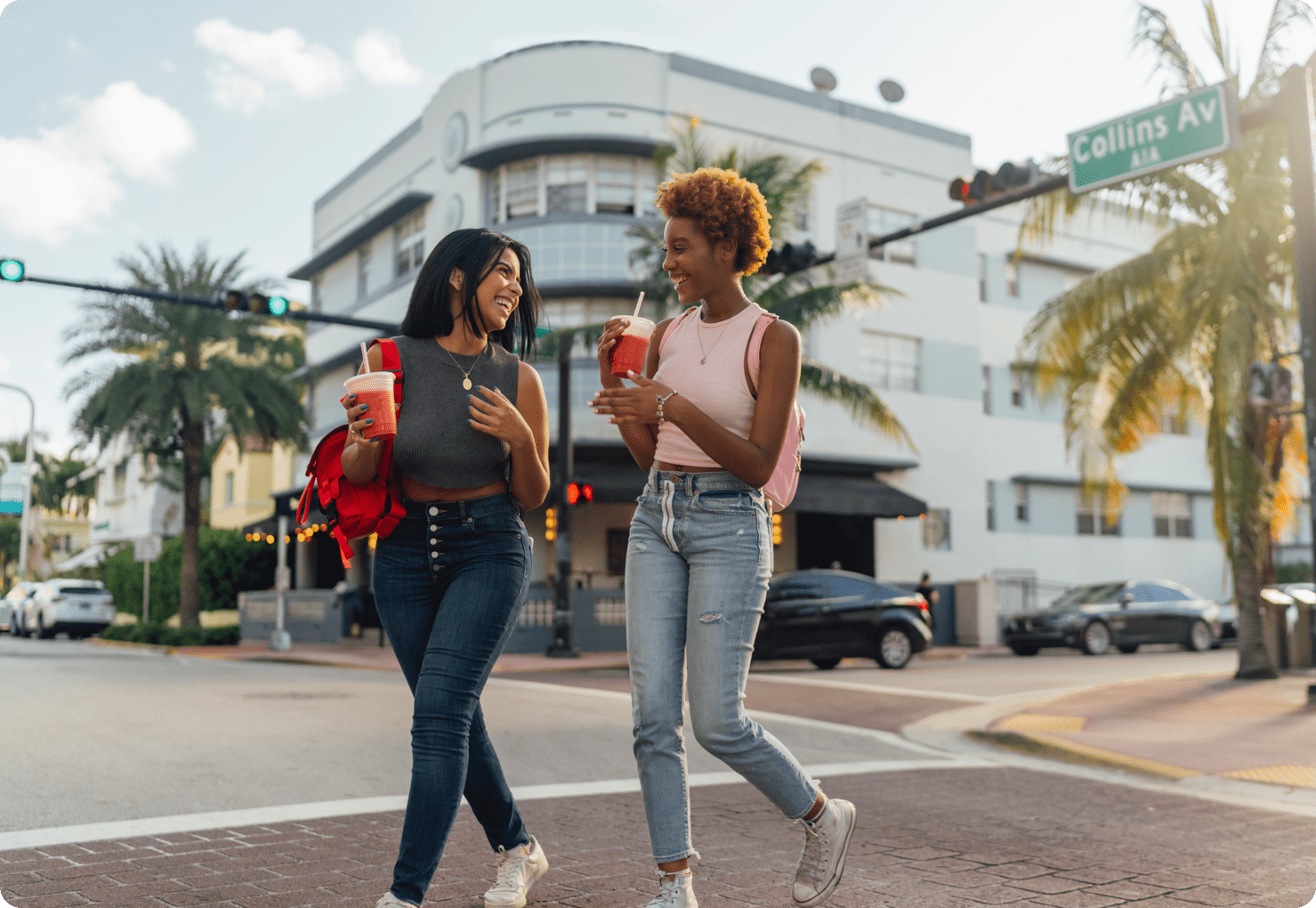 two friends crossing miami street