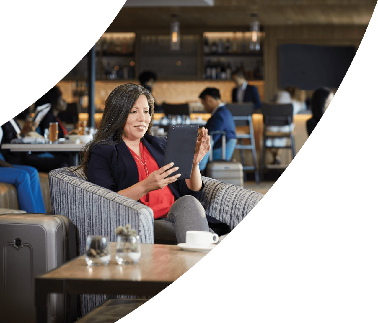 woman using tablet in airport lounge