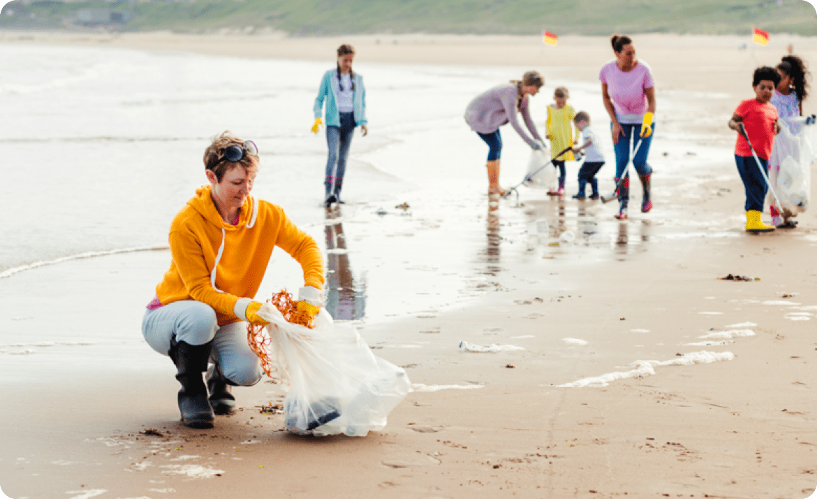 volunteers cleaning beach
