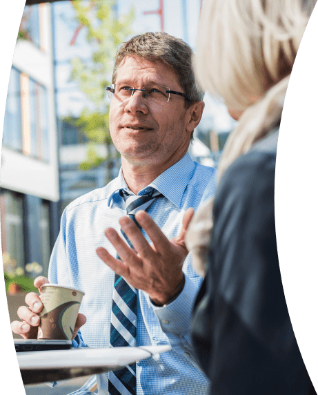 man drinking coffee in conversation